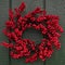 A winterberry wreath celebrating the Chistmas season