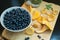 Wintering on the wooden plate: blueberries, pine and mushroomst