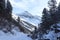 Wintery snowy path with trees and mountain in Stubai Alps mountains