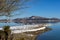 Wintry, landscape. Black snowy mountain, clear sky on lake Plastira at a winter day, Greece.