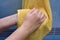 Wipe hands a yellow towel