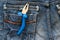 Wire cutting plier in blue jeans pocket.