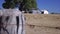 Wire fence with farm sheds pull focus