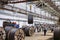 Wire rod, fittings in warehouses. worker alongside a bundle with catalkoy. industrial storehouse at the metallurgical