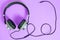 Wired headphones in khaki on a purple background