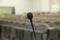 Wired microphone close up with copy space . Close up of microphone in concert hall or conference room . Wired microphone set up on