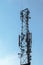 Wireless comunication tower with antenna on clear sky