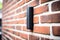 wireless doorbell on a brick wall