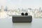 Wireless earbud headphones with portable speaker on table for music
