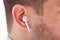 Wireless Earphone In Man`s Ear