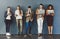 Wireless entertainment for the wait. Studio shot of a group of businesspeople using wireless technology while waiting in