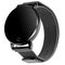 Wireless smart watch in a round matte black case on a metal strap