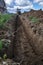 Wiring of an electric cable on the dug trench, supply of the electric power to the house on the earth