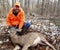 Wisconsin deer hunter with a buck