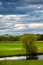 Wisconsin farmland and  pond with a dramatic sky in September