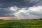 Wisconsin farmland with sunrays coming out of the clouds in September