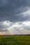 Wisconsin farmland with sunrays coming out of the clouds in September