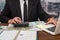 wise male businessman working with important documents at office desk.