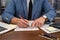 wise male businessman working with important documents at office desk.