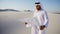 Wise Muslim Arabian UAE Sheikh construction guy inspects area an