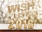 Wish list 2016 wood texture on marble table with sparkling bokeh wall,holiday concept