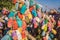 Wish tree. Small multi-colored jugs with inscriptions, wishes hanging on the branches of a tree., against the backdrop