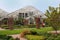 Wisley, Surrey, UK - April 30 2017: Temperate greenhouse and ornate formal landscaped garden