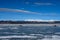 Wispy clouds looking down on ice fishers