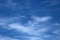 Wispy white cloud in blue sky abstract background