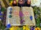 Witch book with spells and symbols, black candles, reiki crystals and flowers