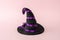 Witch hat on a pink background. Minimal Halloween spooky concept