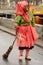 Witch mask with broom at Carnival parade, Stuttgart