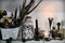 Witch ritual objects and black candles on shelf