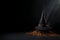 Witch\\\'s hat and broomstick on a dark surface