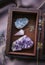 Witch tools inside beautiful old wood box. Rose quartz pendulum  natural amethyst and celestite crystal clusters. Dry lavender flo