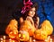 Witch woman with Jack O\'Lantern.