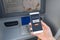 Withdraw money from an ATM without using a credit card