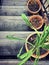 Withered plants in pots on old wooden staircase