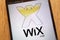 Wix.com logo displayed on a modern smartphone