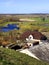 Wizna, Masuria region / Poland - 2007/04/14: Panoramic view of wetland meadows and village of Stregowa Gora by the Narew river