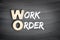 WO - Work Order acronym, business concept on blackboard