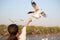 Woamn hand Feeding with seagulls