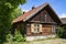 Wojnowo, Old wooden russian Philippians house in a polish Masuria. Summer, sunny day, blue sky above.