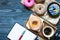 Woking Desk Table with Colorful Donuts breakfast composition