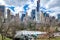 Wollman Rink with People Ice Skating during winter with skyline of Manhattan, NYC