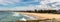 Wollongong Beach looking south towards Port Kembla steel works