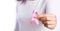 Womaen hand holding pink ribbon breast cancer awareness. concept healthcare and medicine