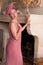 Woman in 1920s dress at fireplace