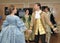 Woman in 19th century costume dances