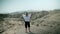 Woman absorbing sunshine energy in Safari landscape